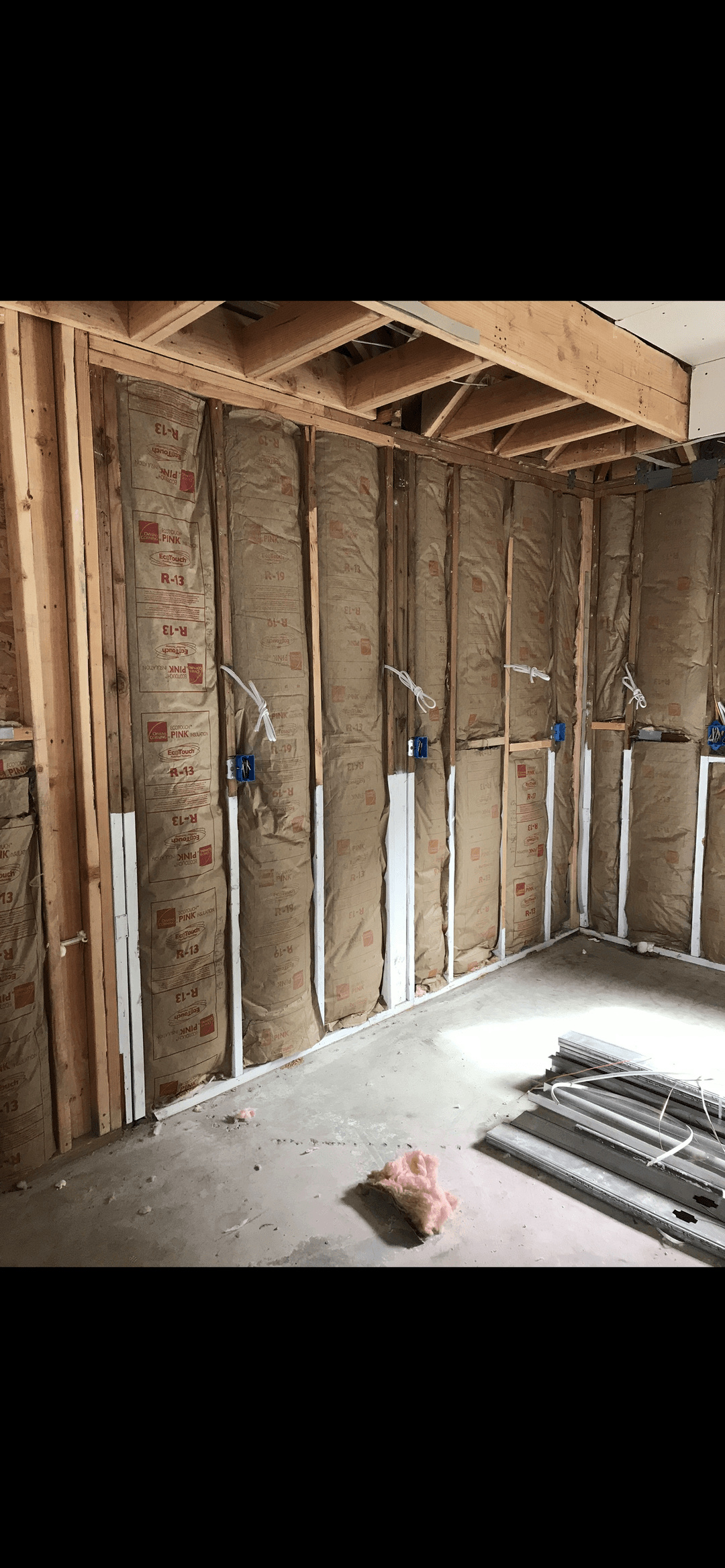 New insulation in a side of a home in between studs